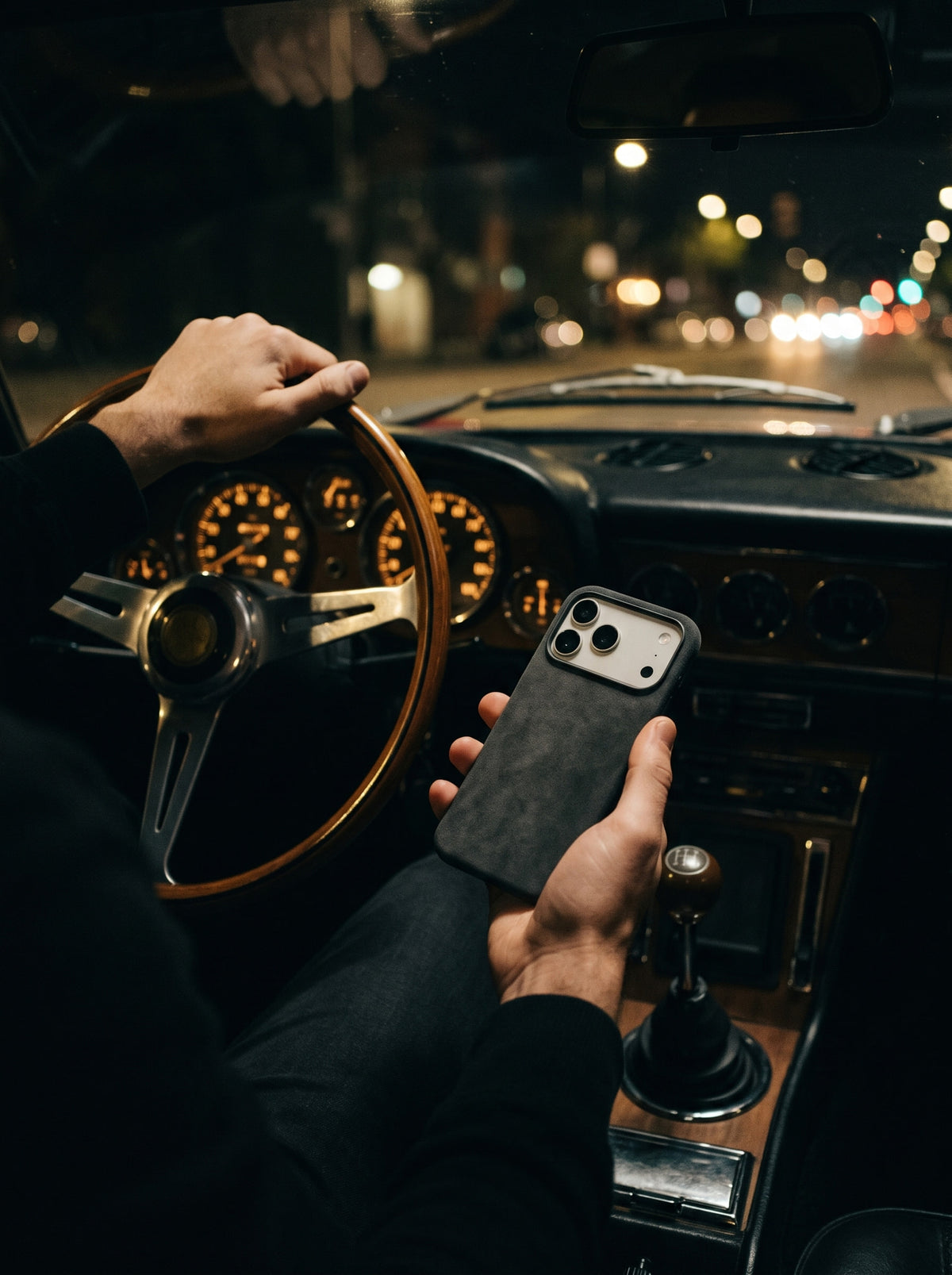 Graphite Velluto Case at the wheel at night