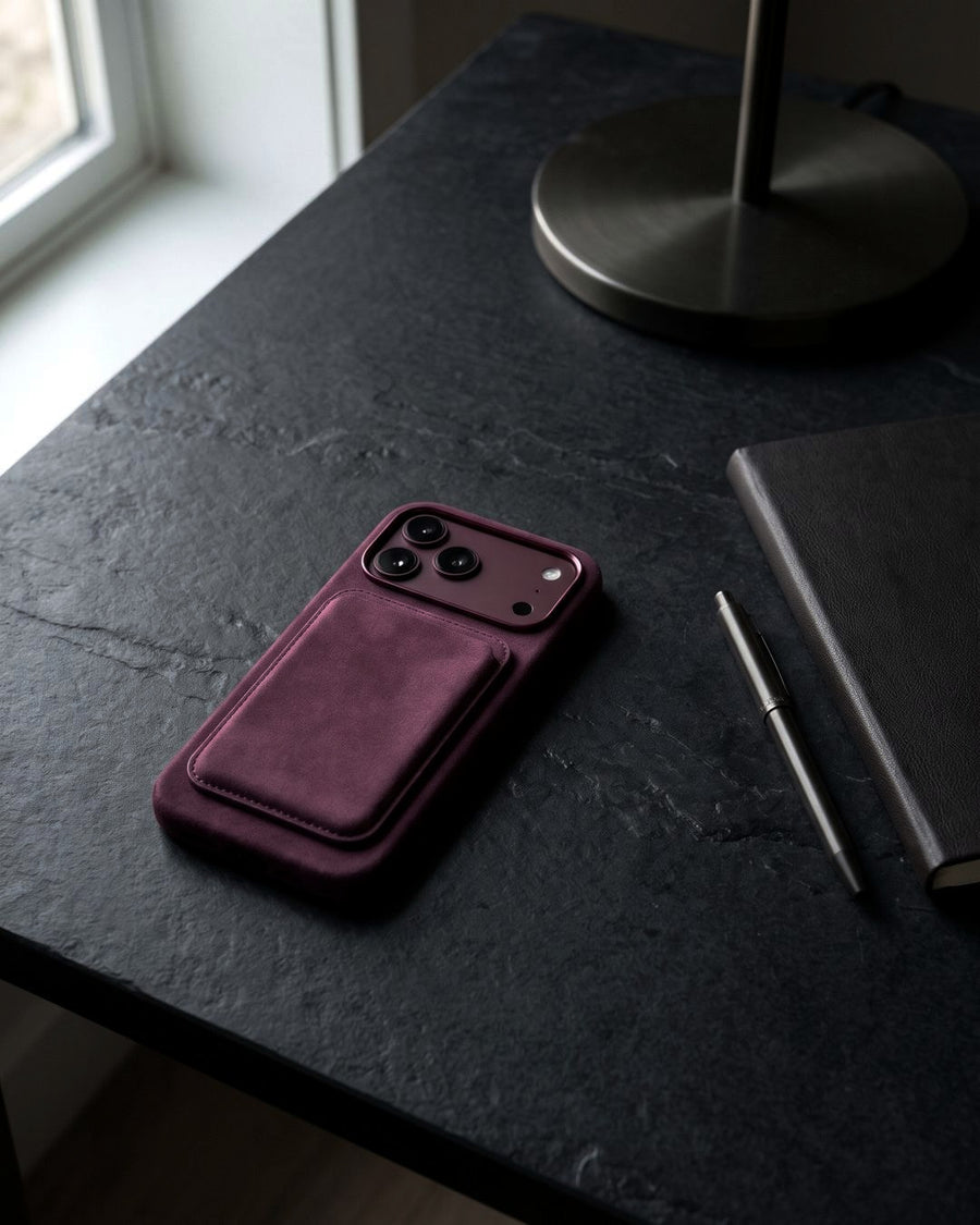 Burgundy Velluto Case and wallet on a stone table