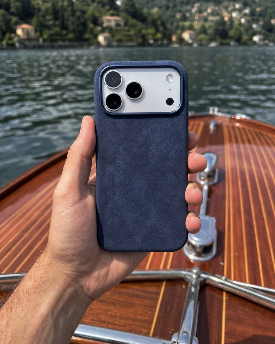 Navy Velluto Case on a boat on Lake Como
