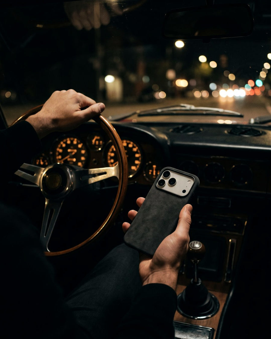 Graphite Velluto Case at the wheel at night